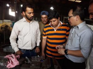 APO expert Alex Yap (R) discussing how to reduce die casing process waste with Grand Engineering staff. (Photo: Alex Yap)